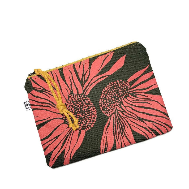 Large Rachel Elise Studio Sangria Coneflower bag has RE Branding tag, a yellow metal zipper, and is dark green and coral.