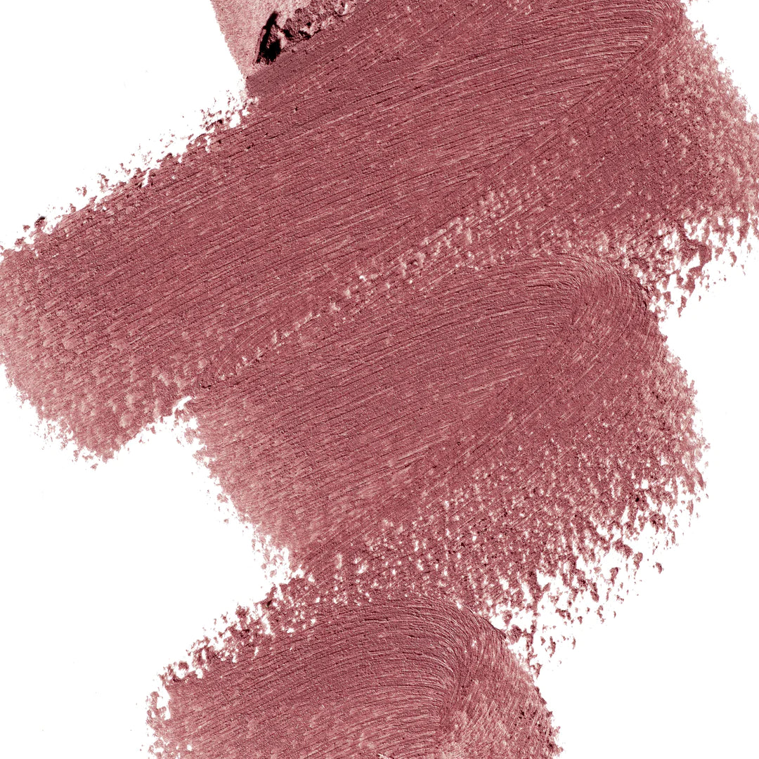A scribble of Manasi 7 Eye and Lip Definer Yokan drawn on a table showing the smooth texture and dusty brownish pink color.