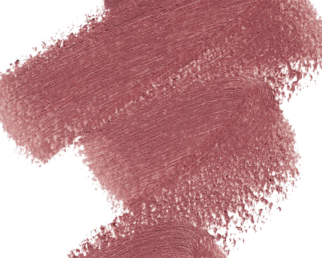 A scribble of Manasi 7 Eye and Lip Definer Yokan drawn on a table showing the smooth texture and dusty brownish pink color.