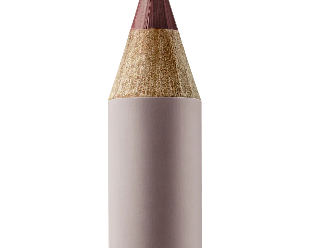 A sharpened Manasi 7 Eye and Lip Definer Yubari Success pencil showing the brown/mauve color. The pencil itself is dark pink.