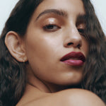 Close-up of a woman with medium complexion with her lips and eyes defined by Manasi 7 Lip and Eye Definer Castel.