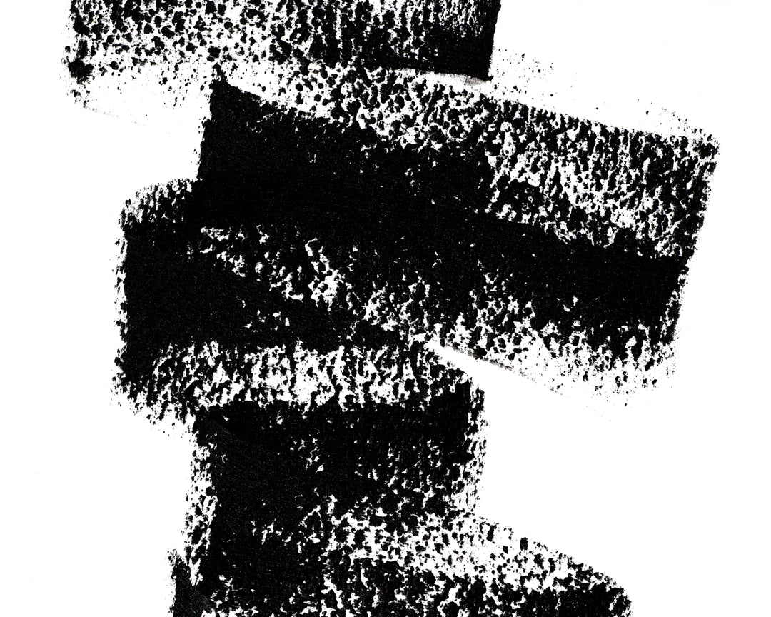 A scribble of Manasi 7 Lip and Eye Definer Petunia drawn on a table showing the smooth texture and charcoal black color.