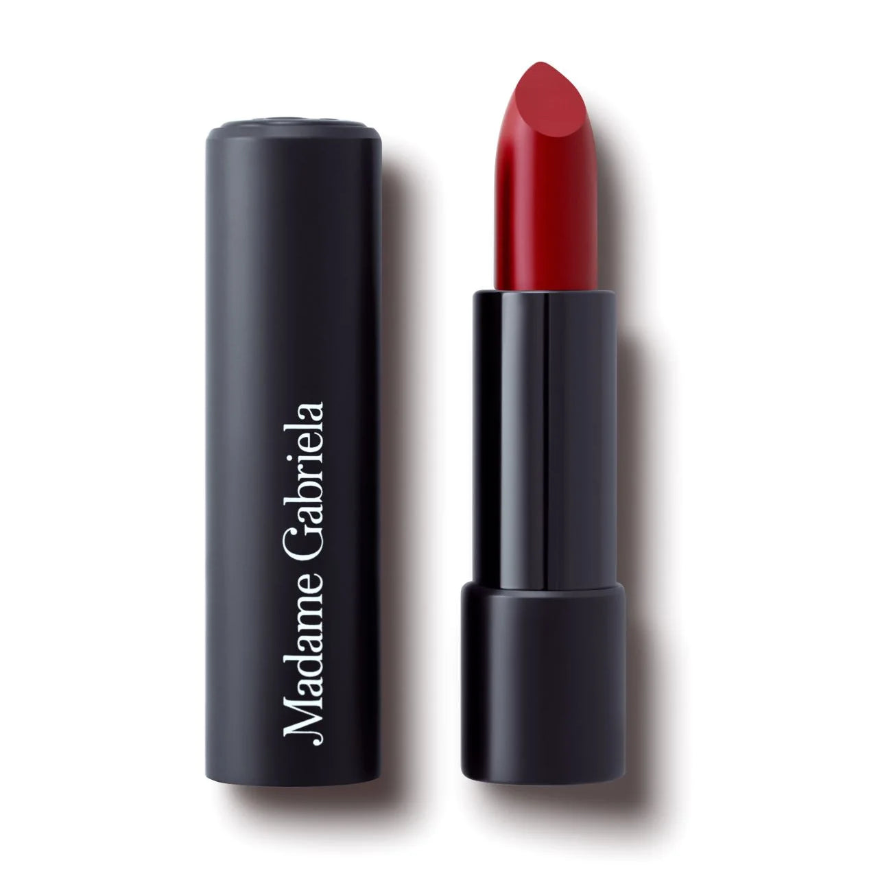 A black press-open tube of Madame Gabriela Clean Beauty Lipstick | Paris at 7 pm with white branding and a berry-red color.