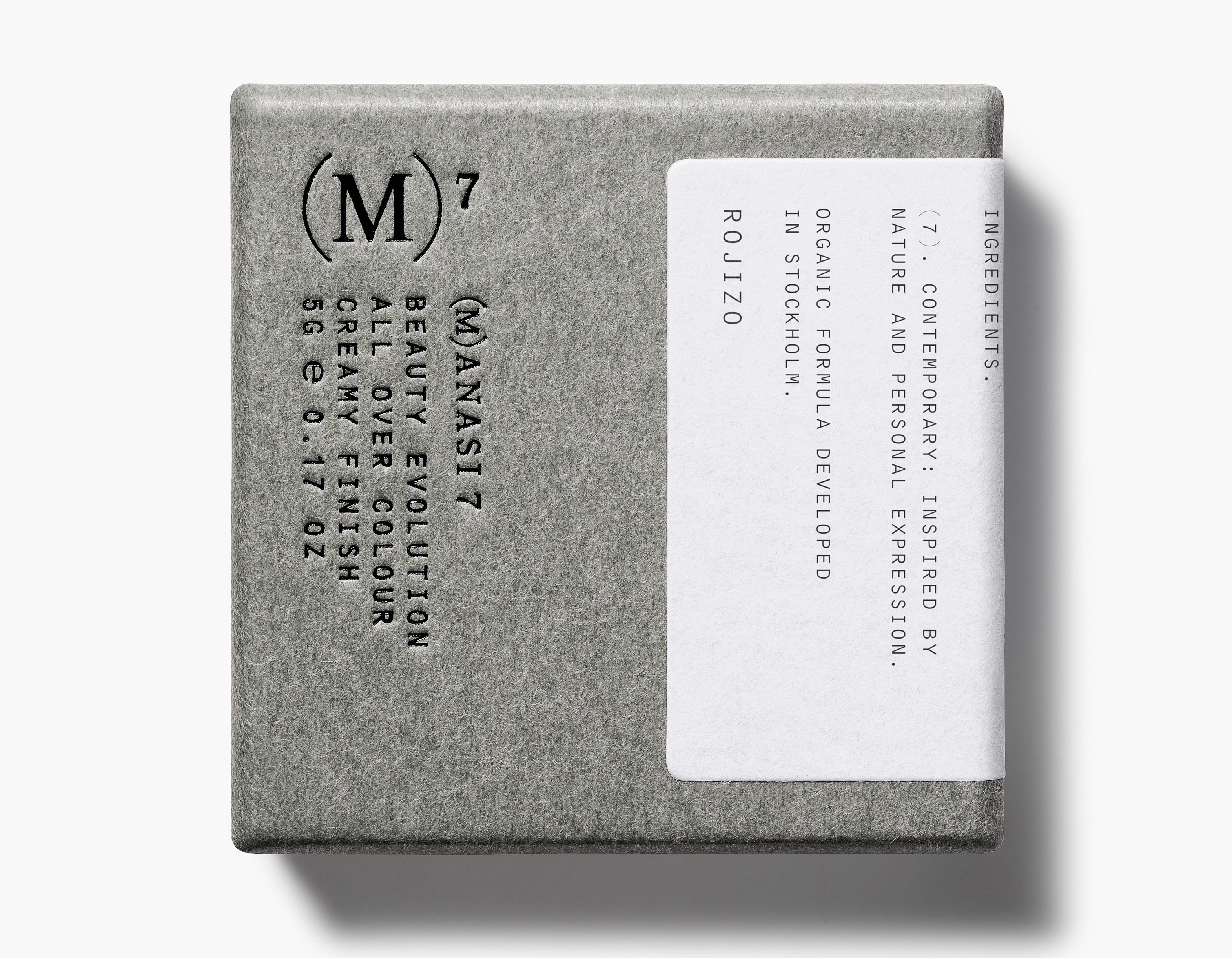 Manasi 7 All Over Colour Rojizo comes in a rectangular grey cardboard package with a white label and black embossed branding.
