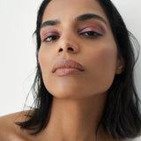 Manasi 7 All Over Colour dianthus on a woman with medium complexion's lips, cheeks, and eyes.