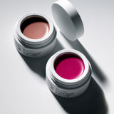 Manasi 7 All Over Colour Chamoisee and Fuchsine come in white compact jars with screw on tops and black branding text.