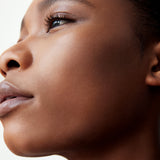 Side profile of a woman with dark complexion wearing Manasi 7 All Over Colour Chamoisee on her lips, cheeks, and eyes.