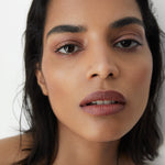 Manasi 7 All Over Colour Chamoisee on a woman with medium complexion's lips, cheeks, and eyes.
