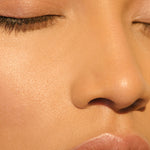 A light-complexioned woman with her eyes closed wearing Manasi 7 All Over Colour Manketti on her lips, cheeks, and eyes.