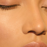 A light-complexioned woman with her eyes closed wearing Manasi 7 All Over Colour Manketti on her lips, cheeks, and eyes.