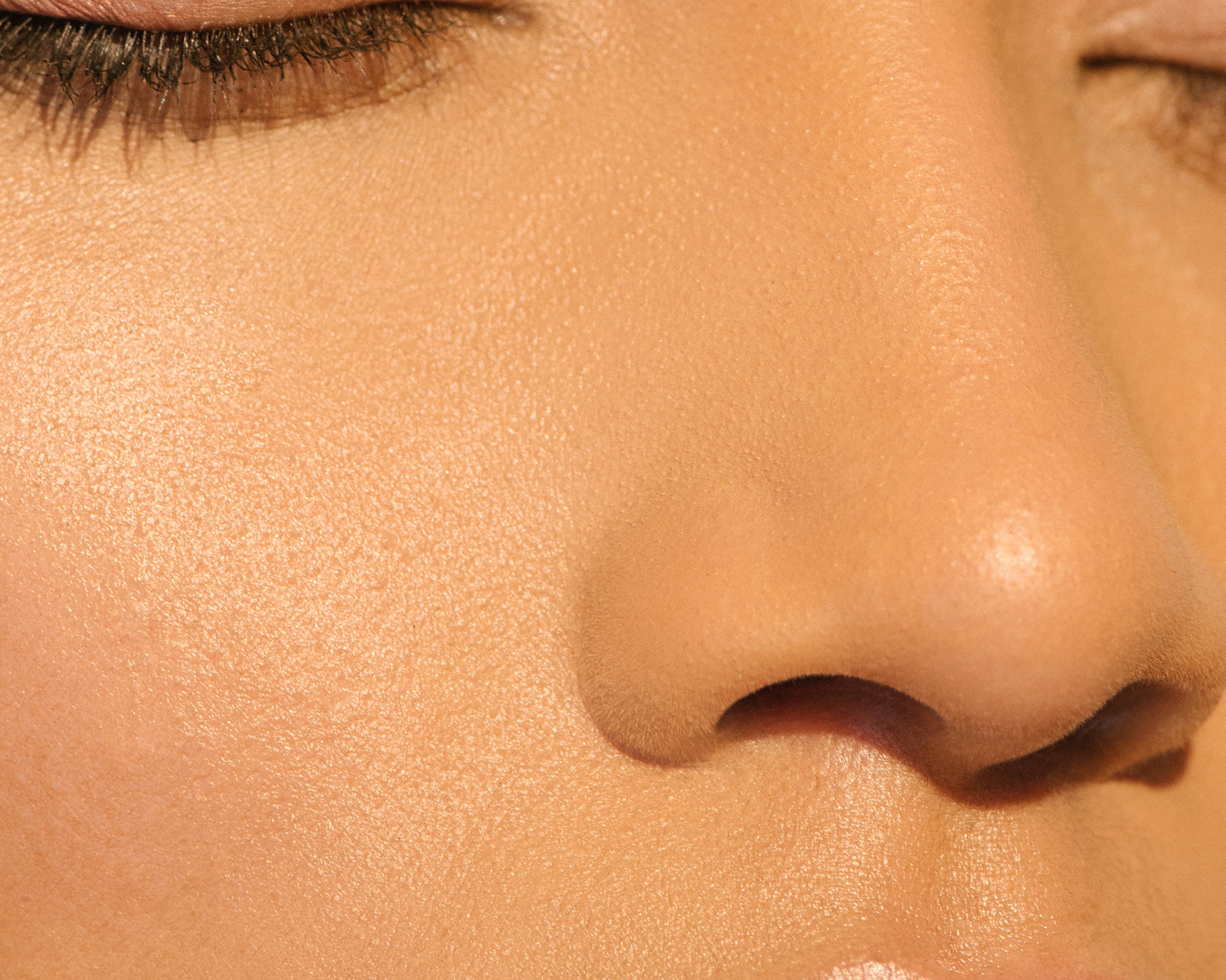 A light-complexioned woman with her eyes closed wearing Manasi 7 All Over Colour Manketti on her lips, cheeks, and eyes.