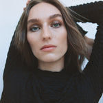 Close-up of a woman with light complexion wearing Manasi 7 Eye and Lip Definer Nocturne on her eyes.