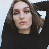 Close-up of a woman with light complexion wearing Manasi 7 Eye and Lip Definer Nocturne on her eyes.
