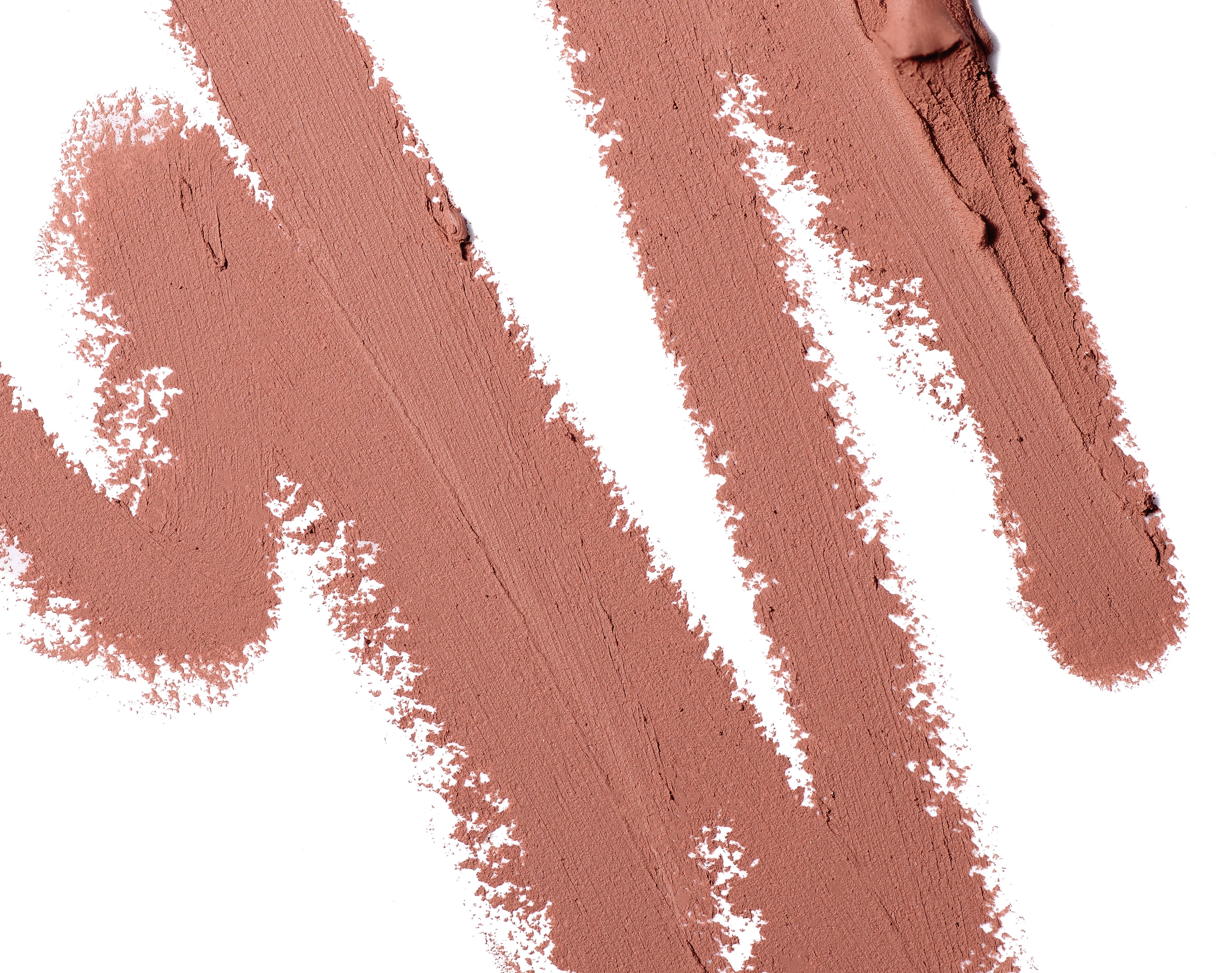 A close-up scribble of Manasi 7 Eye and Lip Definer Ukiyo drawn on a table showing the smooth texture and warm natural color.