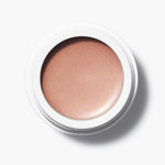 Manasi 7 Bronzelighter Roseate Radiant Finish comes in a white compact jar with its top removed, showing its vibrant color.