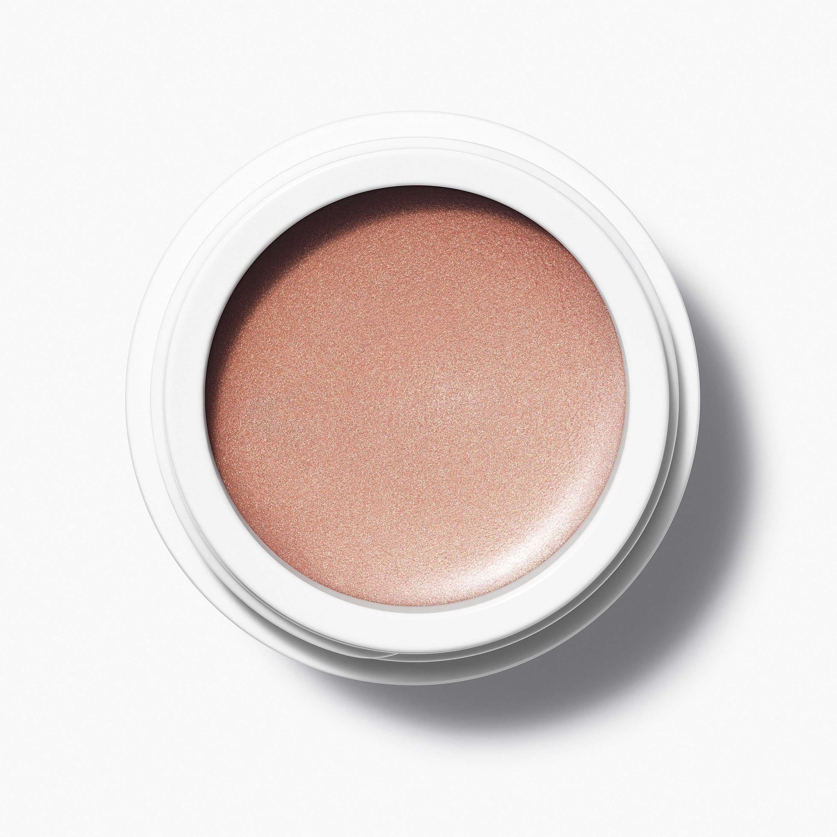 Manasi 7 Bronzelighter Roseate Radiant Finish comes in a white compact jar with its top removed, showing its vibrant color.