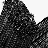Close-up swatch of Manasi 7 Precision Mascara Obsidian, showcasing its deep black pigment and defined wand texture.