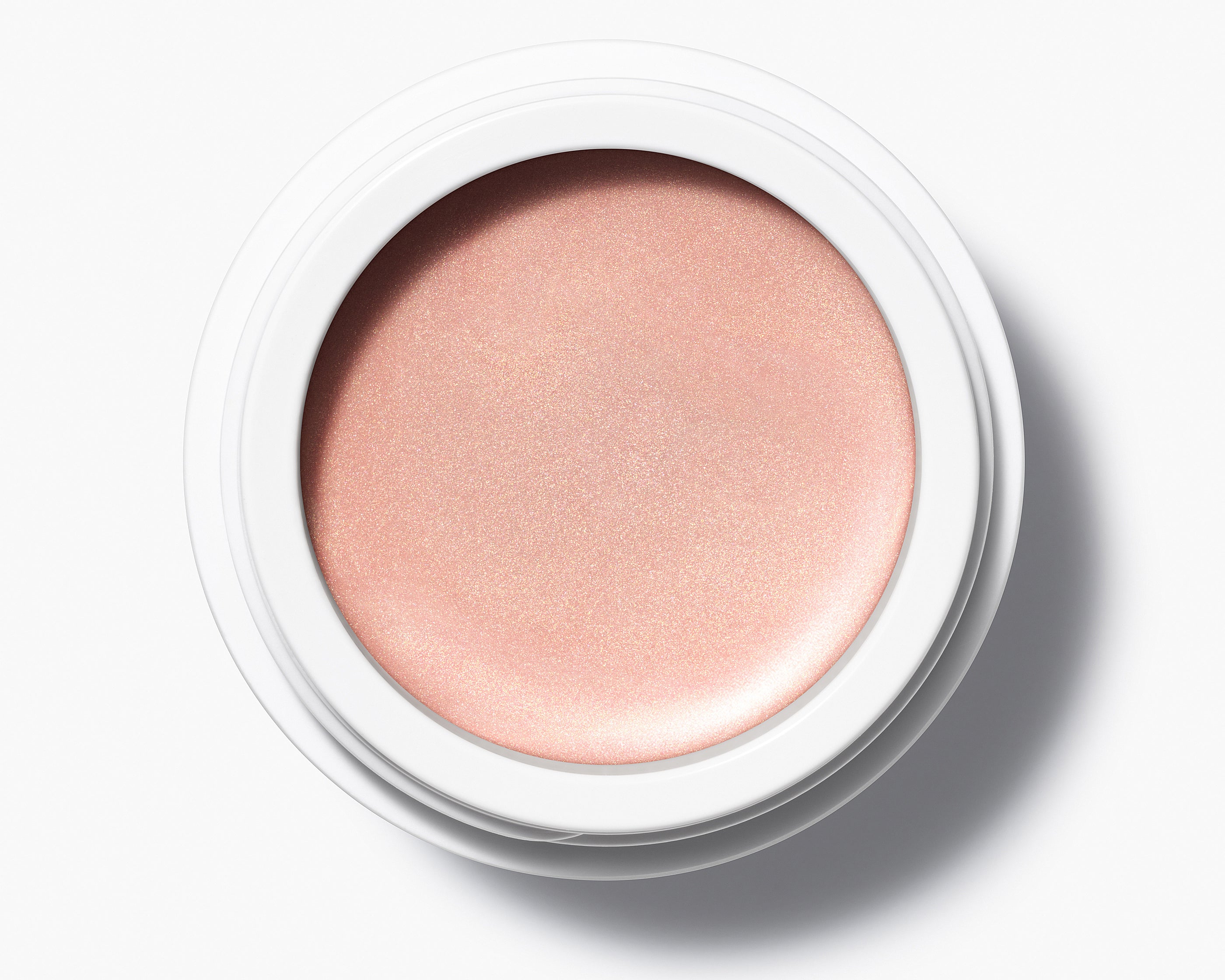 Manasi 7 Strobelighter Delirio Radiant Finish comes in a white compact jar with its top removed, showing the rose gold color.