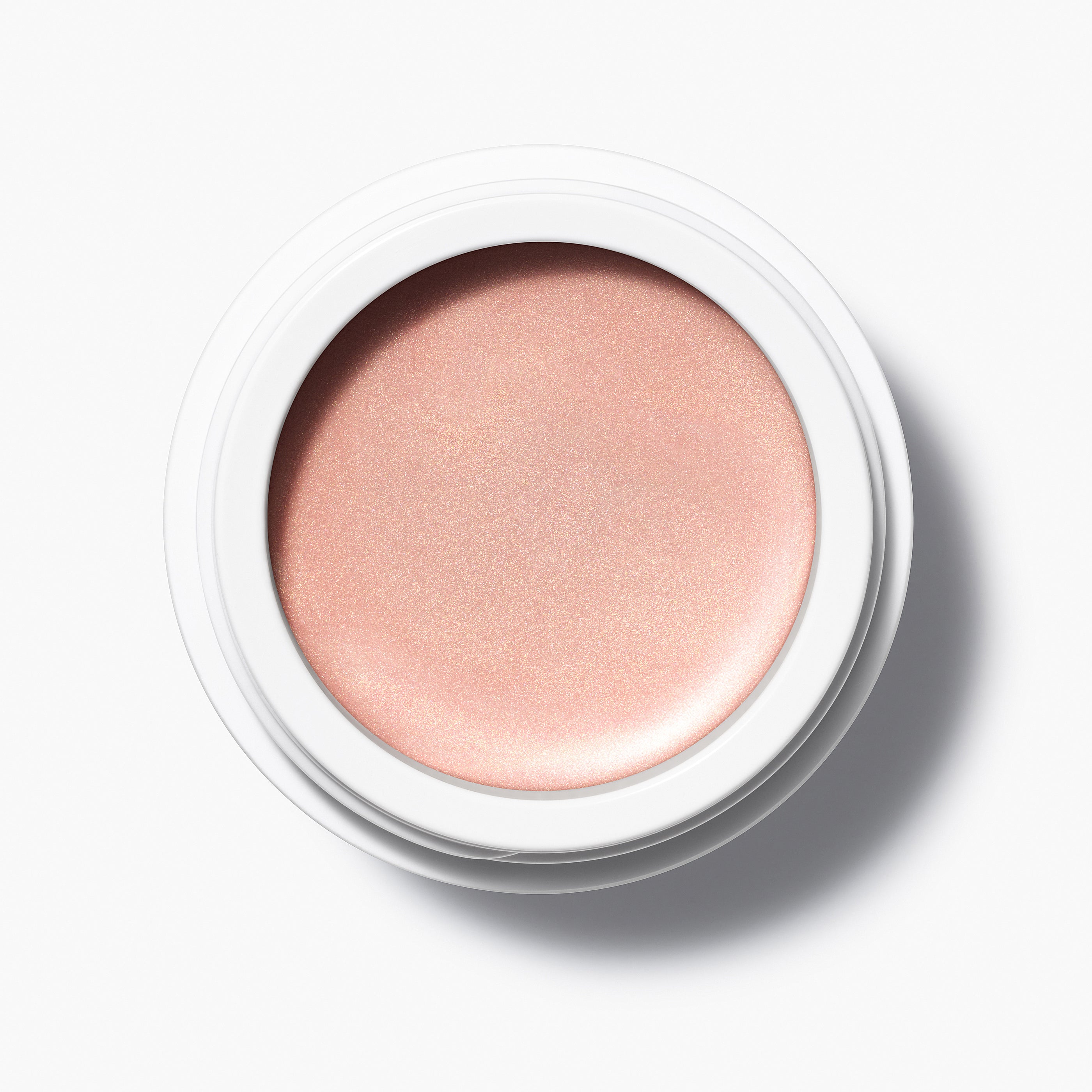 Manasi 7 Strobelighter Delirio Radiant Finish comes in a white compact jar with its top removed, showing the rose gold color.
