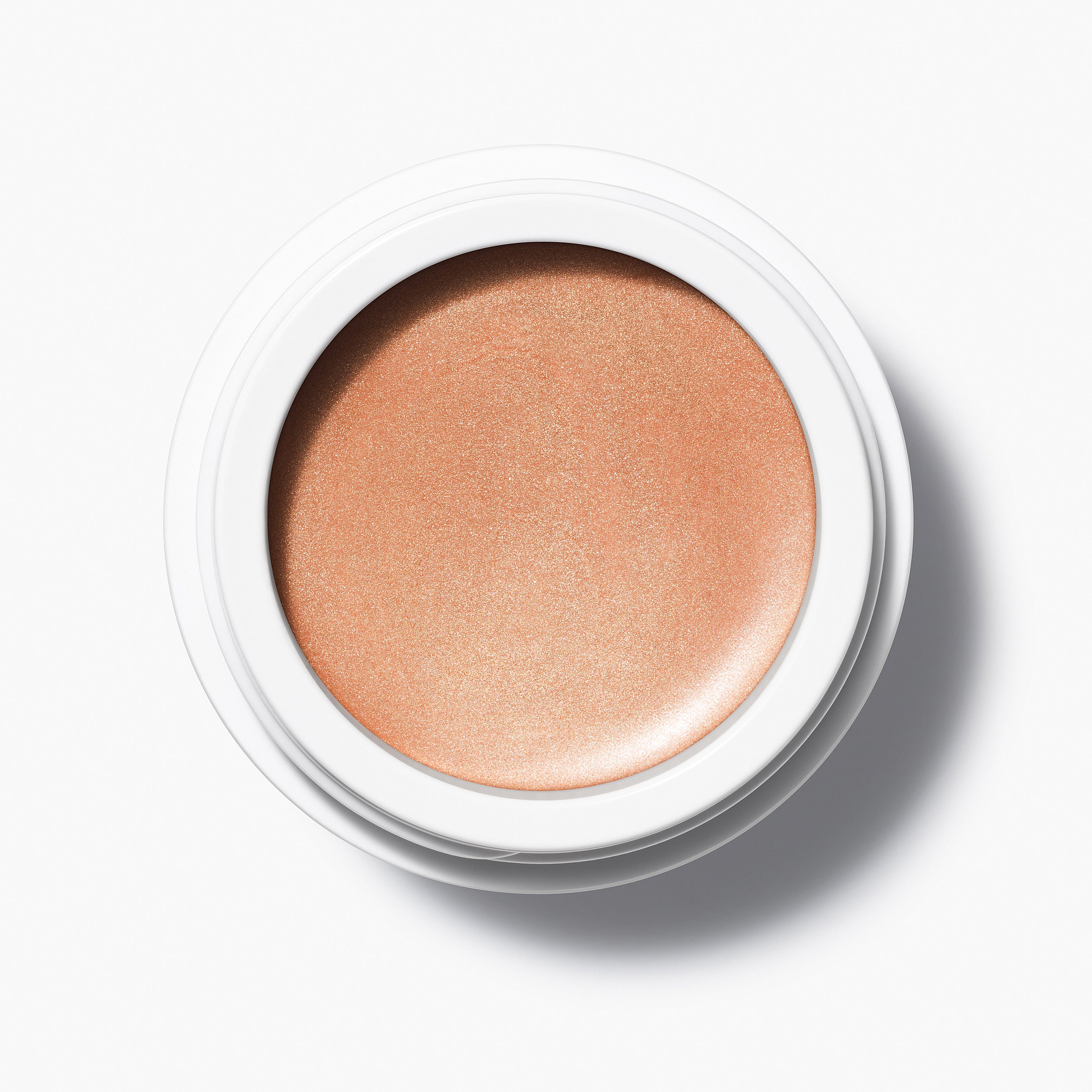 Manasi 7 Strobelighter Heliconia Radiant Finish comes in a white compact jar with its top off, showing the bronze-golden color.