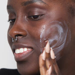 
  
  Person applying Ere Perez Moringa All Beauty Crème
  
