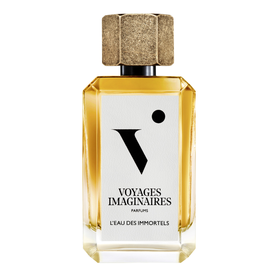 
  
  L'eau Des Immortels perfume in a geometric glass bottle with white logo sticker and textured gold magnetic cap.
  

