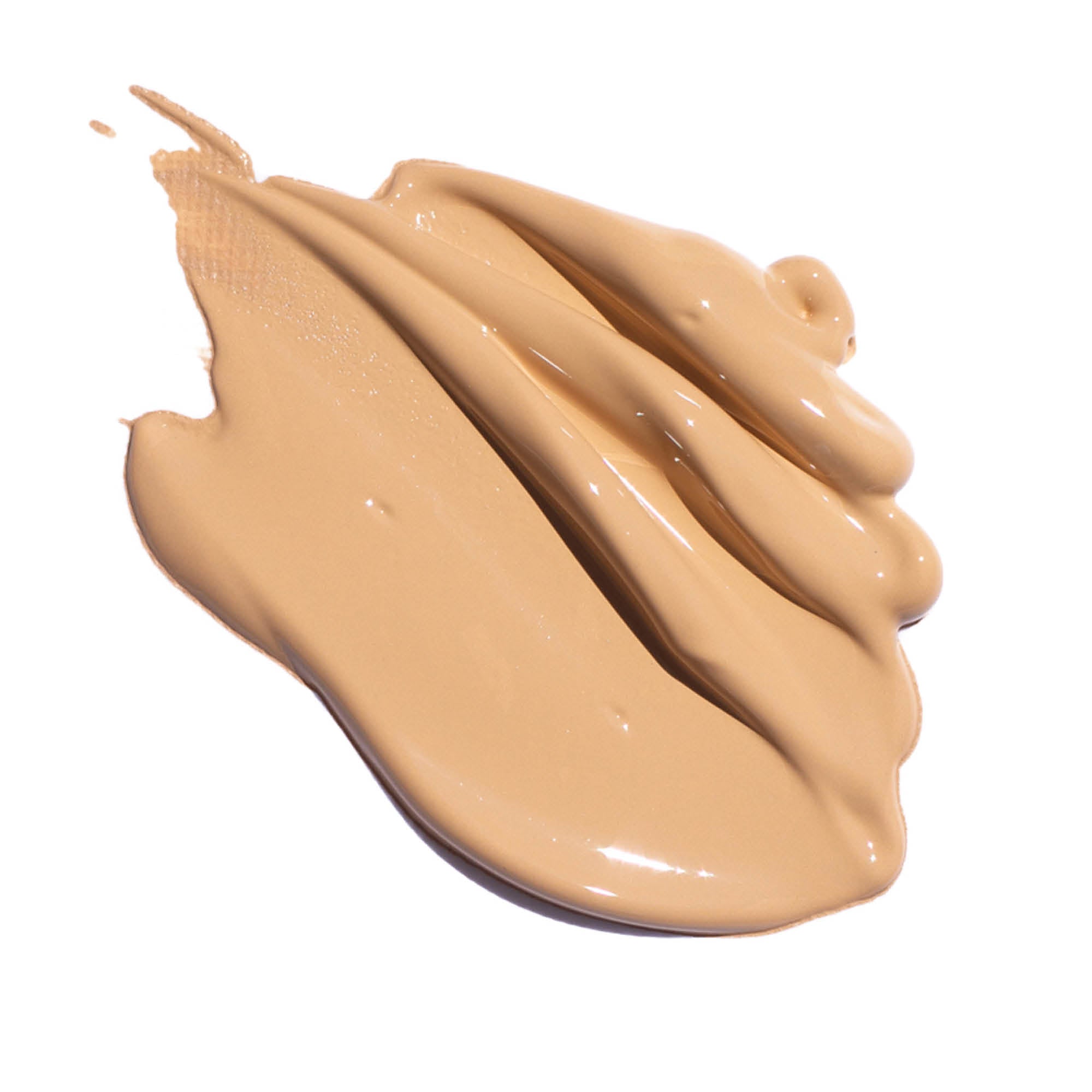 
  
  A creamy swatch of Ere Perez Oat Milk Foundation Chai, suited for light-medium skin tones.
  
