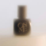 
  
  Osmé Fragrance PIRYTE black bottle and top in a misty image on a counter.
  
