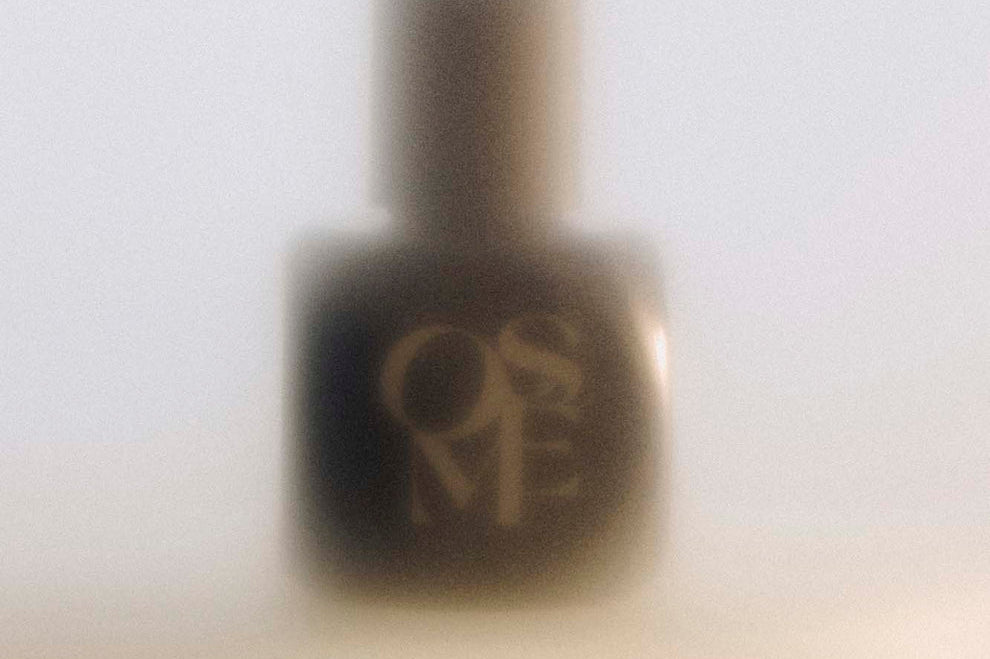 
  
  Osmé Fragrance PIRYTE black bottle and top in a misty image on a counter.
  
