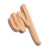 
  
  A creamy swatch of Ere Perez Oat Milk Foundation Vienna, suited for light skin tones.
  
