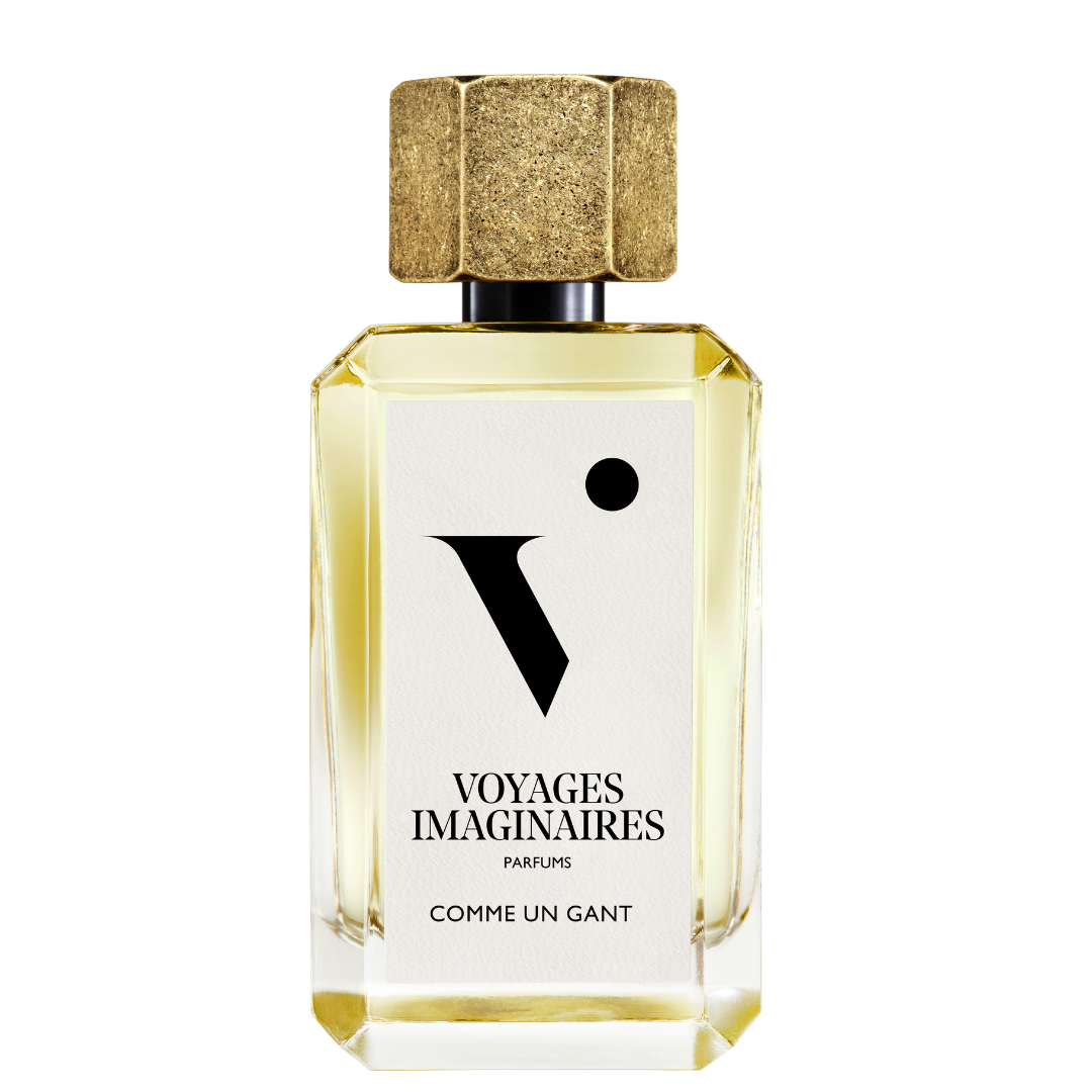 
  
  Comme Un Gante perfume in a faceted glass bottle with white logo sticker and textured gold magnetic cap.
  
