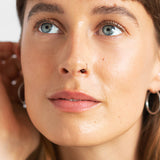 
  
  Ere Perez Oat Milk Foundation Chai on a woman with light complexion and neutral undertones.
  
