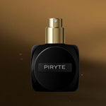 
  
  Osmé Fragrance PIRYTE Black and gold perfume bottle labeled 'PIRYTE' on a brown background
  
