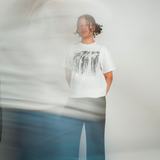 
  
  Person wearing LORDE Beauty Power Love Artist Designed Graphic T-Shirt
  
