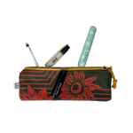 
  
  Small Rachel Elise Studio Garden Sunflower case partially unzipped to show makeup and skincare inside.
  
