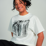 
  
  Person wearing LORDE Beauty Power Love Artist Designed Graphic T-Shirt
  
