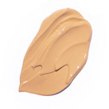 
  
  A creamy swatch of Ere Perez Oat Milk Foundation Brew,  suited for medium skin tones.
  
