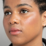 
  
  Ere Perez Oat Milk Foundation Brew on a woman with medium complexion and neutral undertones.
  
