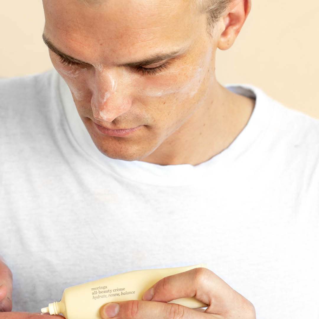 
  
  Person applying Ere Perez Moringa All Beauty Crème
  
