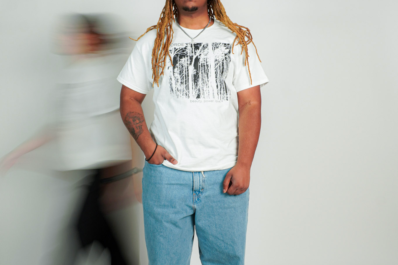 
  
  Person wearing LORDE Beauty Power Love Artist Designed Graphic T-Shirt
  
