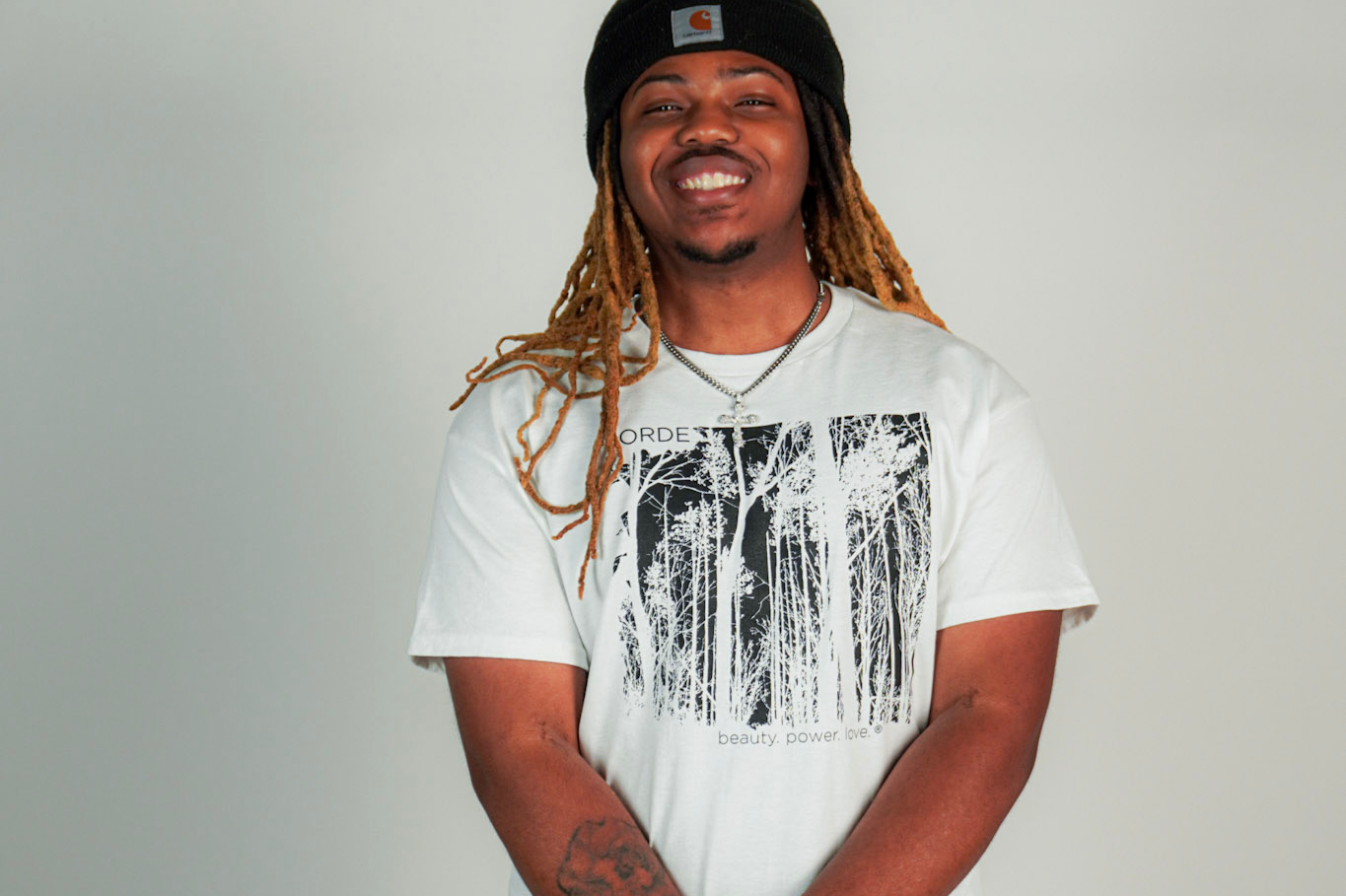 
  
  Person wearing LORDE Beauty Power Love Artist Designed Graphic T-Shirt
  
