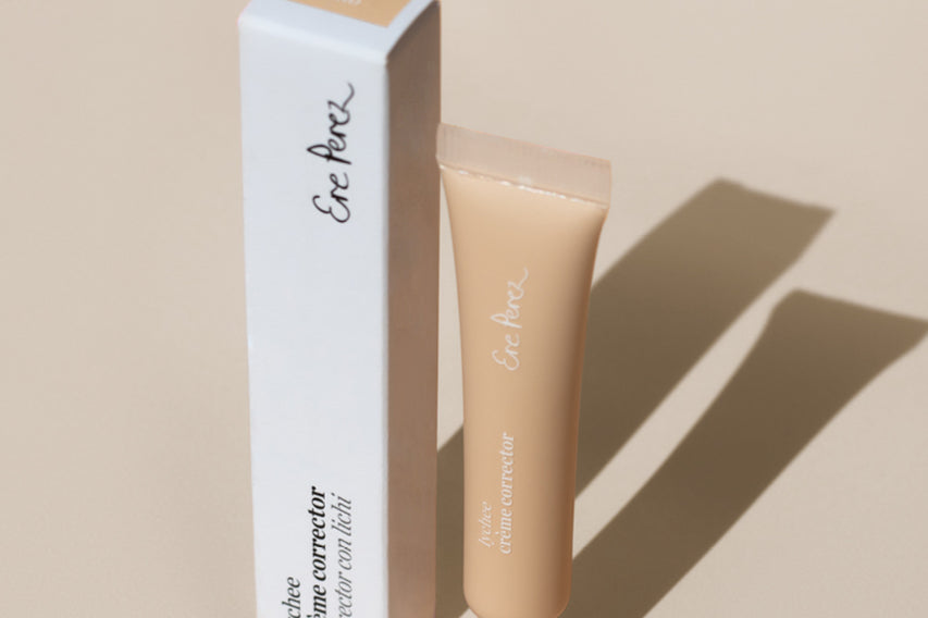 
  
  Ere Perez Lychee Creme Correctors Uno comes in a clear squeeze tube with a white screw-on top alongside its white box.
  

