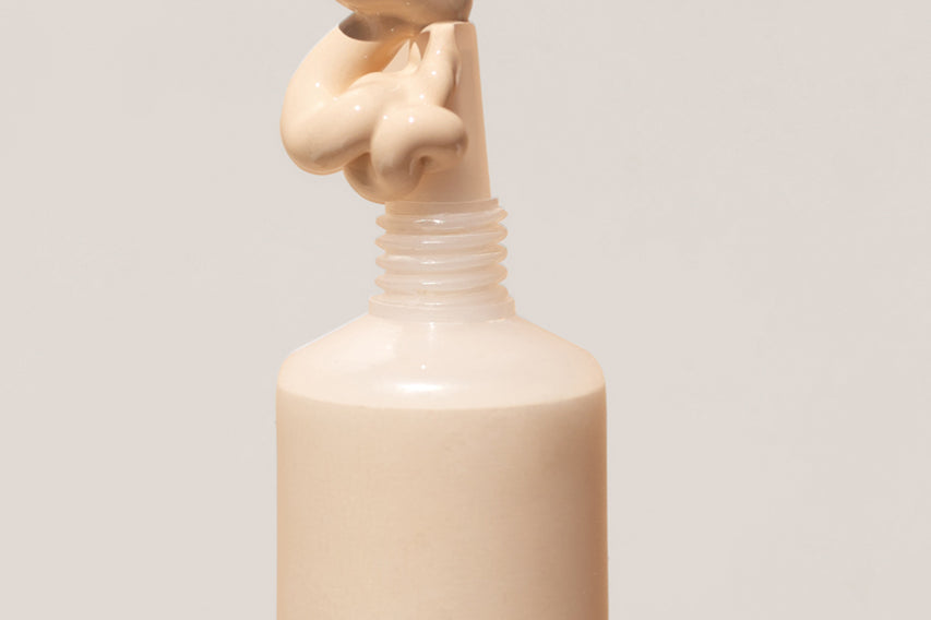 
  
  Close-up of Ere Perez Lychee Creme Corrector Uno being squeezed out of its tube.
  
