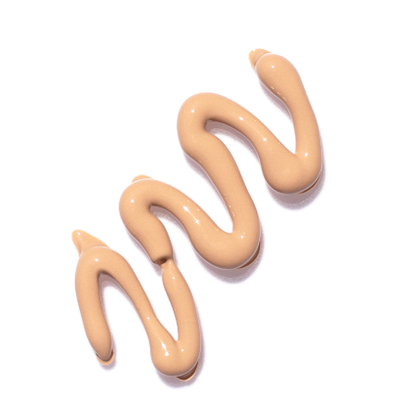 
  
  A scribbled swatch of Ere Perez Lychee Creme Corrector Dos, suited for light skin tones.
  
