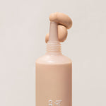 
  
  Close-up of Ere Perez Lychee Creme Corrector Tres being squeezed out of its tube.
  
