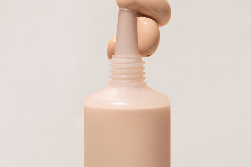 
  
  Close-up of Ere Perez Lychee Creme Corrector Tres being squeezed out of its tube.
  
