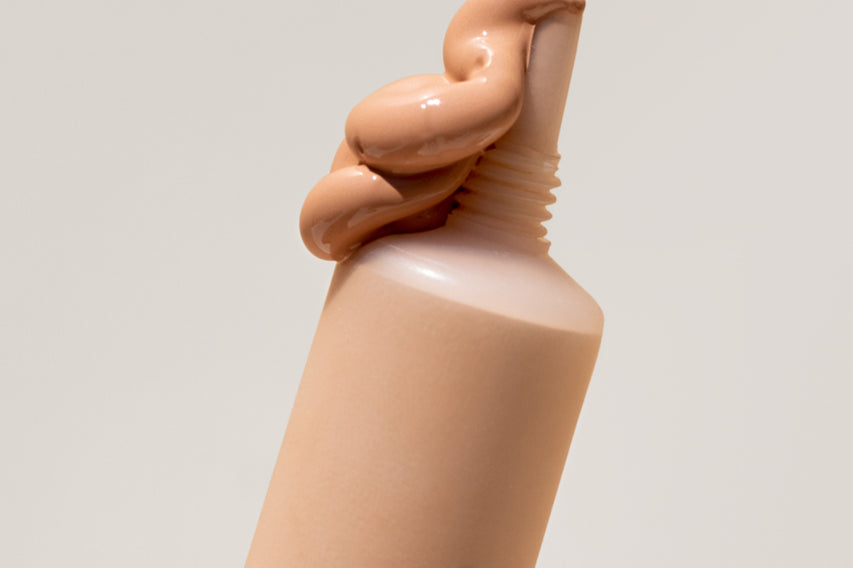 
  
  Close-up of Ere Perez Lychee Creme Corrector Cinco being squeezed out of its tube.
  
