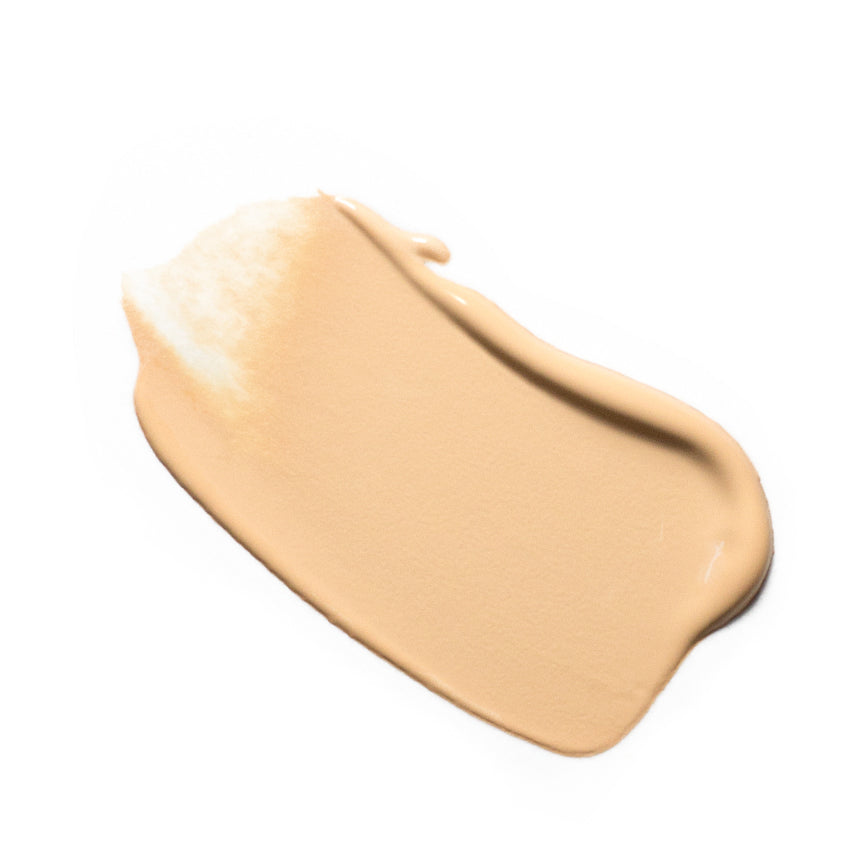 
  
  A creamy swatch of Ere Perez Oat Milk Foundation Honey, suited for light skin tones.
  
