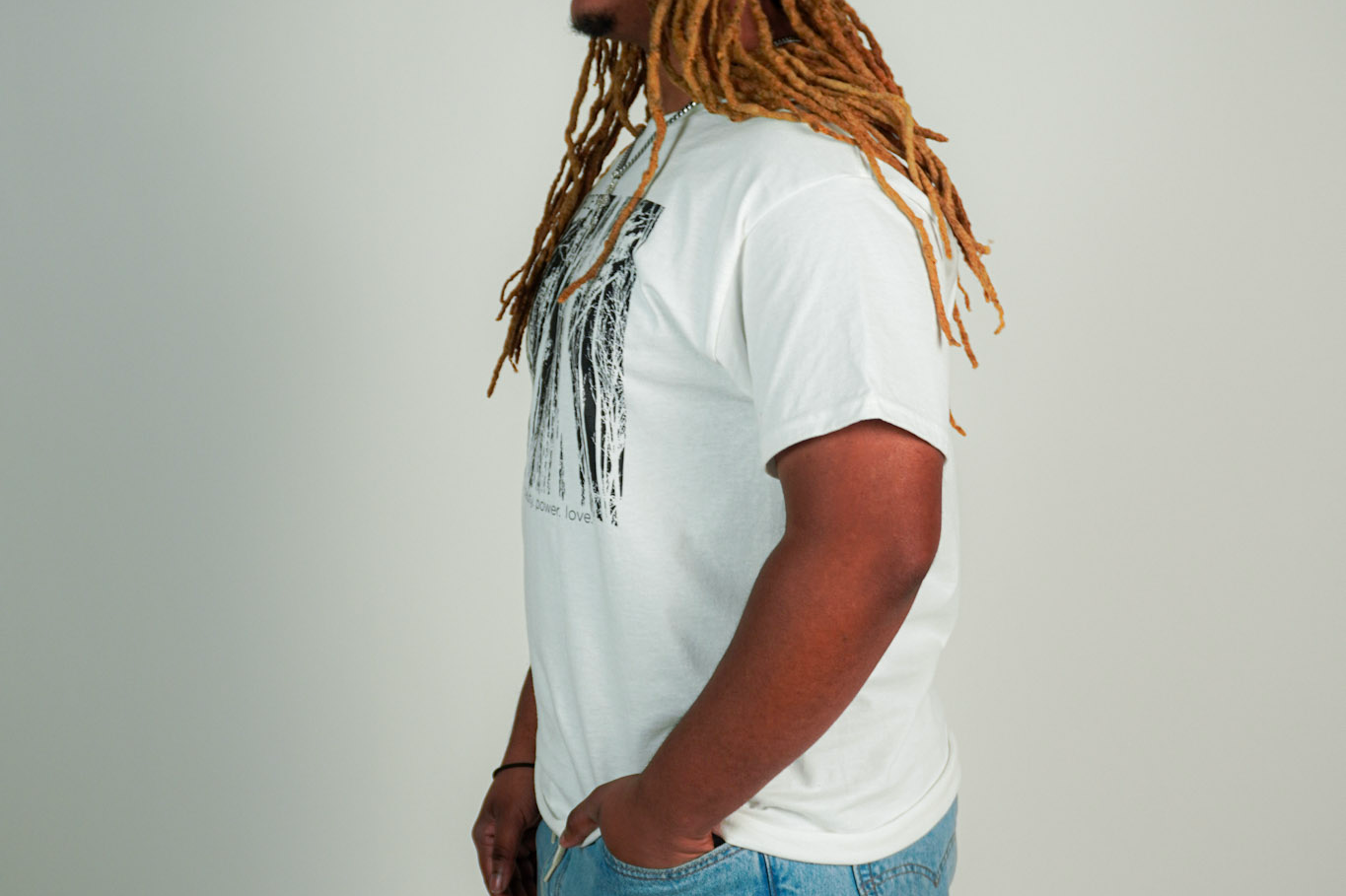 
  
  Person wearing LORDE Beauty Power Love Artist Designed Graphic T-Shirt
  
