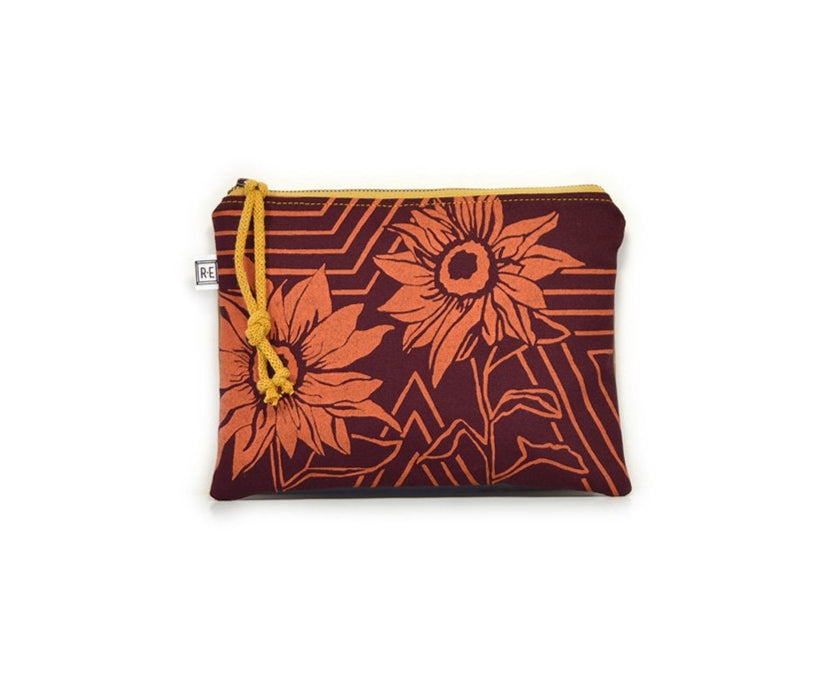 
  
  Large Rachel Elise Studio Afterglow Sunflower bag in dark red and orange with a yellow metal zipper and an RE label on the side. 
  
